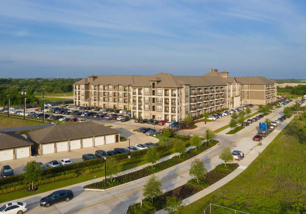 Aerial view of the community with parking at Orleans at Fannin Station in Houston, Texas