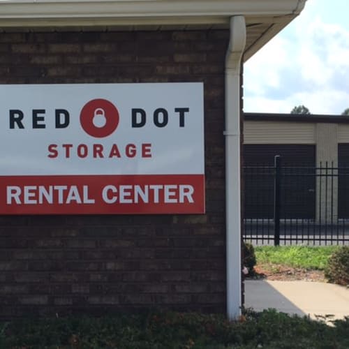 Outdoor storage units and rental center sign at Red Dot Storage in Terre Haute, Indiana