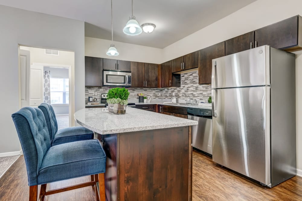 Gourmet kitchen with adaptable island at Torrente Apartment Homes in Upper St Clair, Pennsylvania