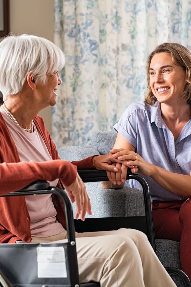 Resident talking with a therapist at Carriage Inn Bryan in Bryan, Texas