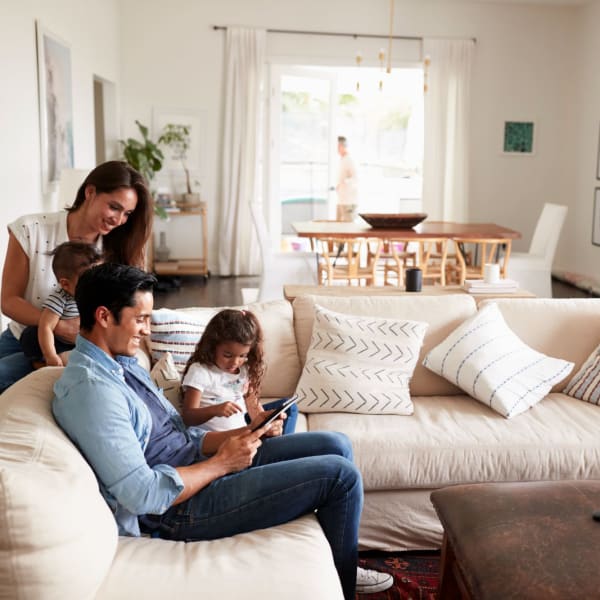 A family enjoys time together in their apartment at Promenade Pointe, Norfolk, Virginia