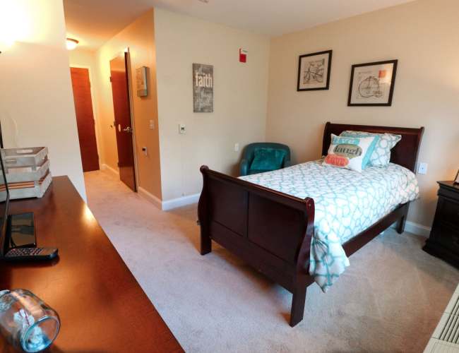 Spacious bedroom with a comfortable bed at The Crossings at Ironbridge in Chester, Virginia