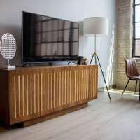 Living room with television at Box Board Lofts in Grand Rapids, Michigan