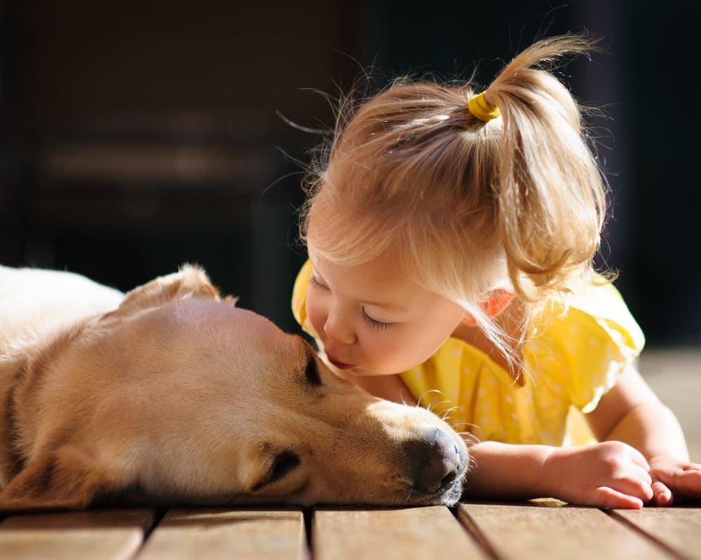 Resident and her puppy in their new home at Sonoma Palms in Las Cruces, New Mexico