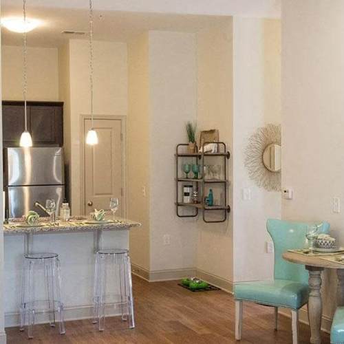 Modern kitchen with dining area at Belle Meade in Wilmington, North Carolina