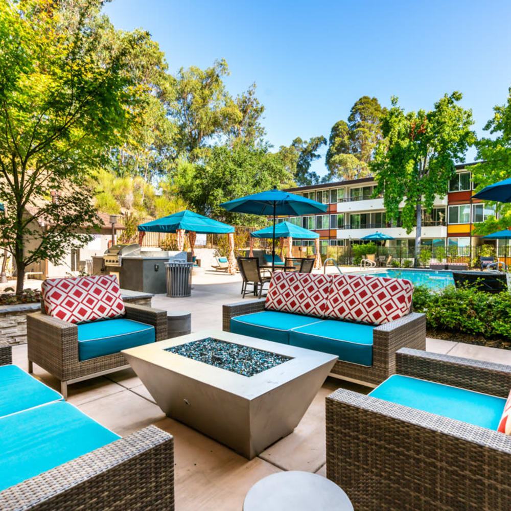 Barbecue area with a gas grill for resident use near the swimming pool at Sofi Belmont Glen in Belmont, California