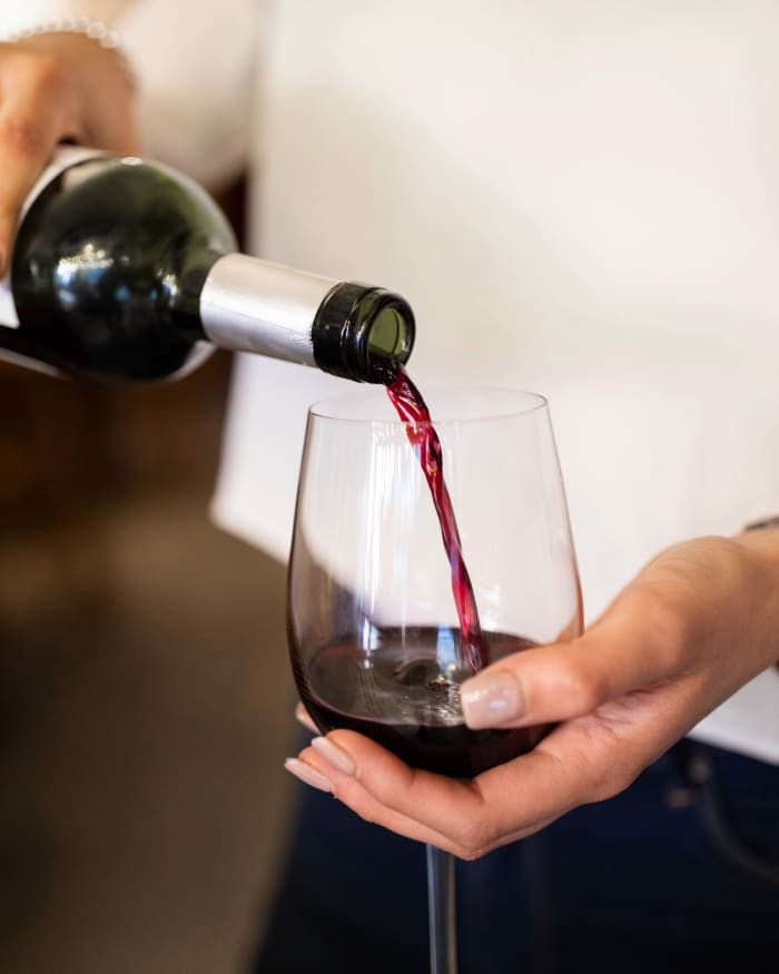 Server pouring wine at The Springs at Happy Valley in Happy Valley, Oregon