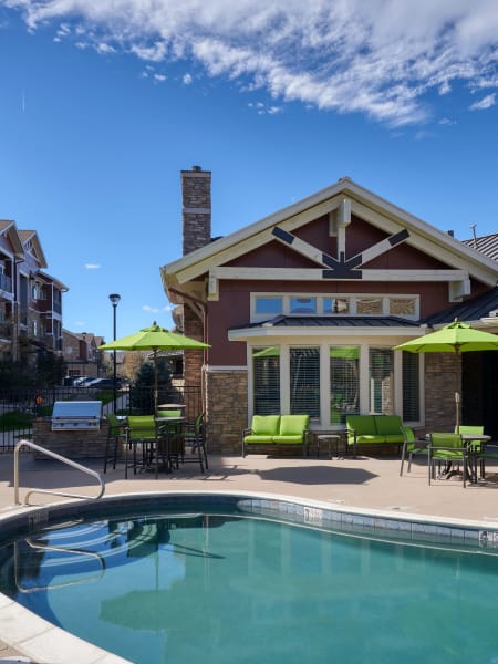 Pool area with lounges at M2 Apartments in Denver