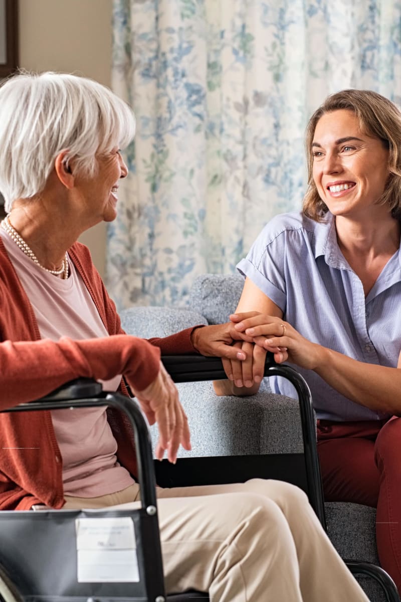 Resident talking with a therapist at Village on the Park Steeplechase in Houston, Texas