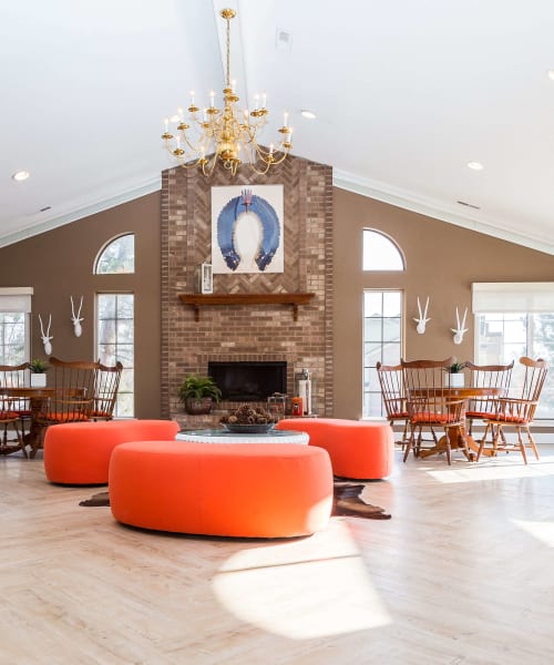 Fireplace sitting area in the resident clubhouse at Saddle Creek Apartments in Novi, Michigan