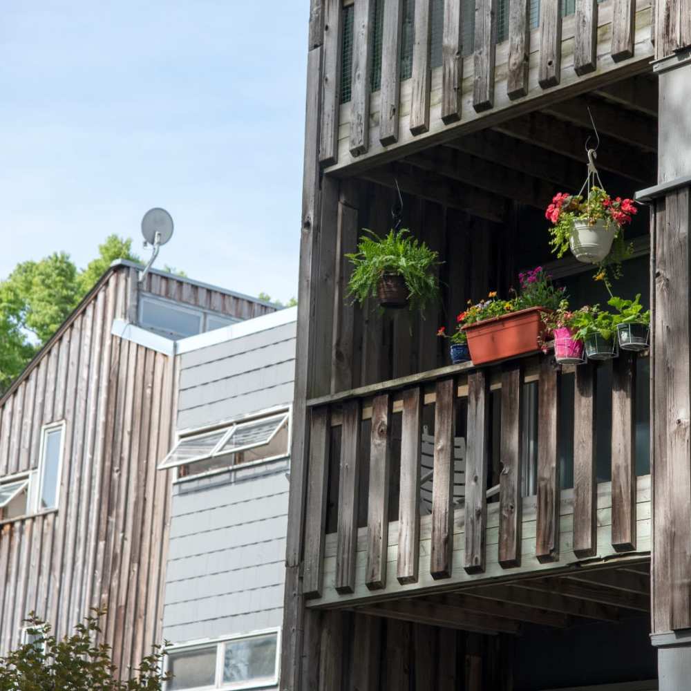 A balcony of the apartment with flowerpots at Bass Lake Crossing in New Hope, Minnesota