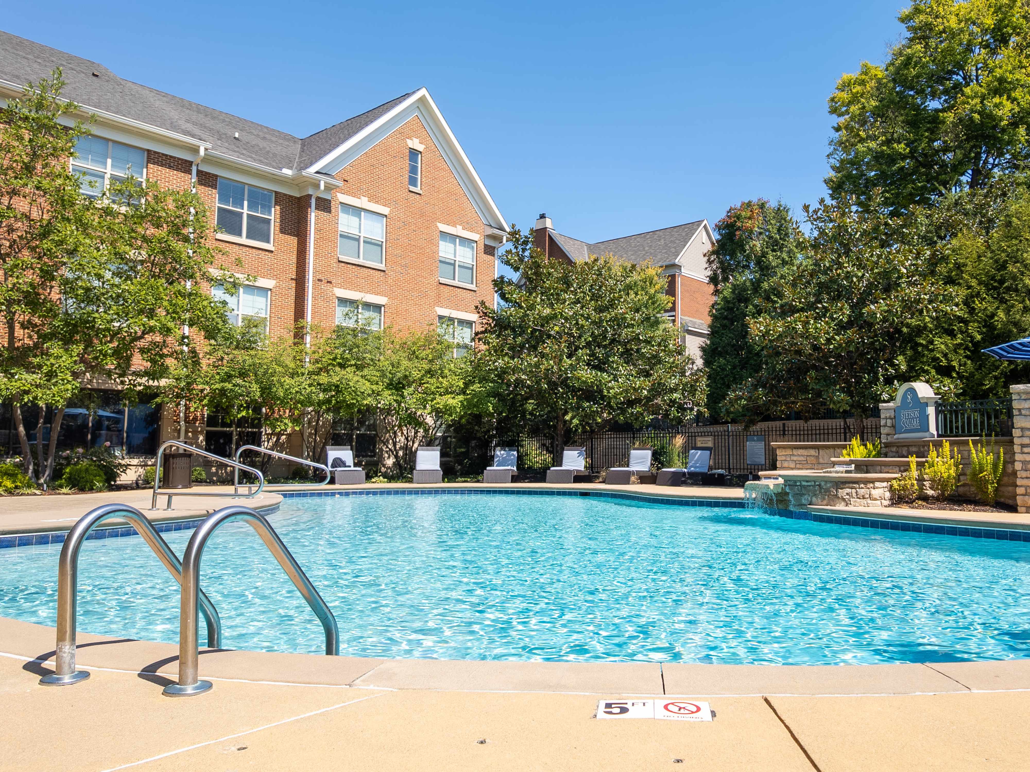 Swimming pool with loungers at The Village at Stetson Square in Cincinnati, Ohio