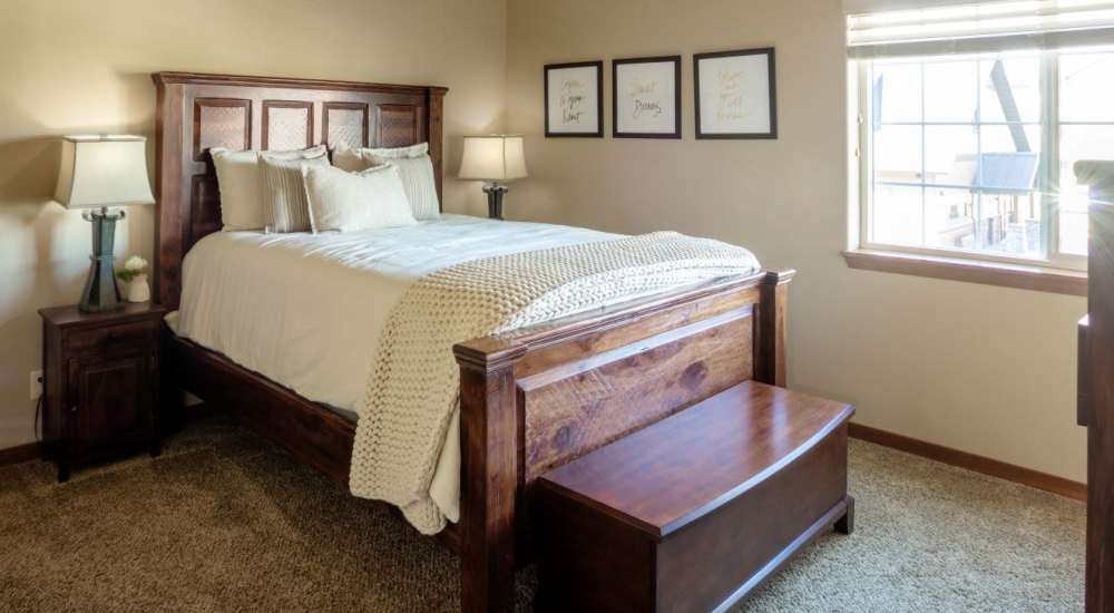 Spacious bedroom with king size bed at InterPointe Apartments in Billings, Montana