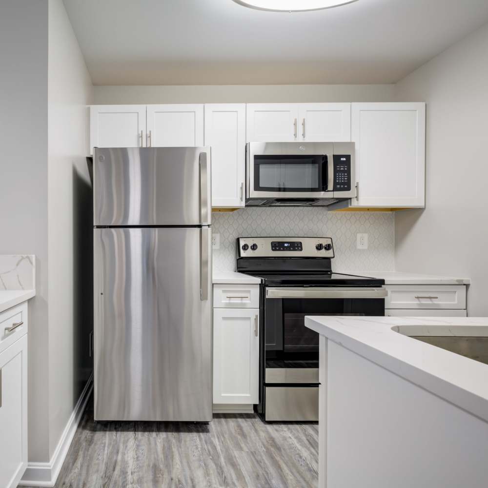 Kitchen with stainless-steel appliances at Chase Heritage in Sterling, Virginia