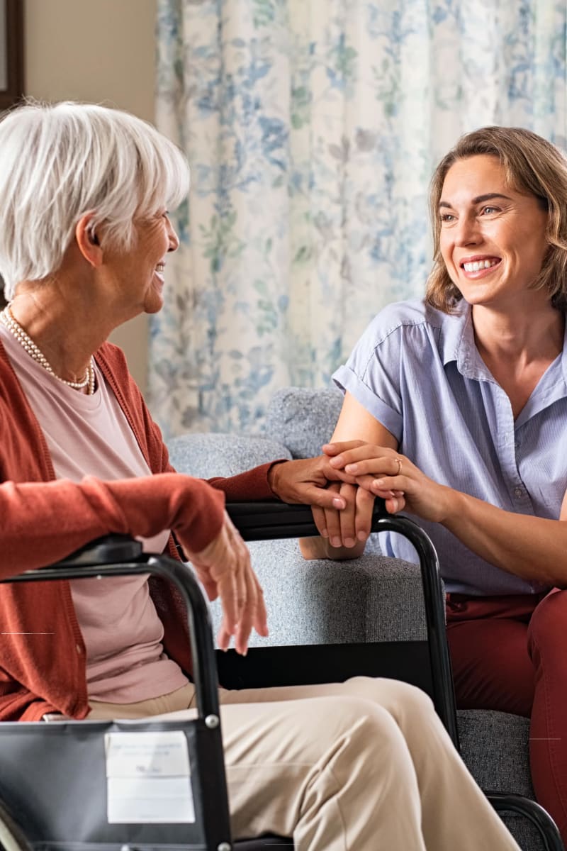 Resident talking with a therapist at Carriage Inn Katy in Katy, Texas