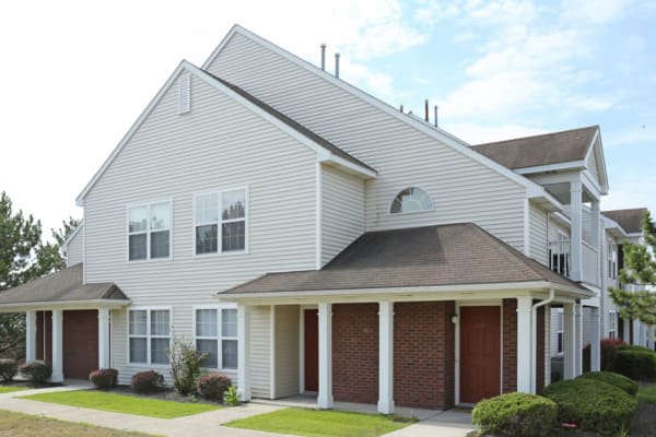 White exterior of building at Bennington Hills Apartments in West Henrietta, New York