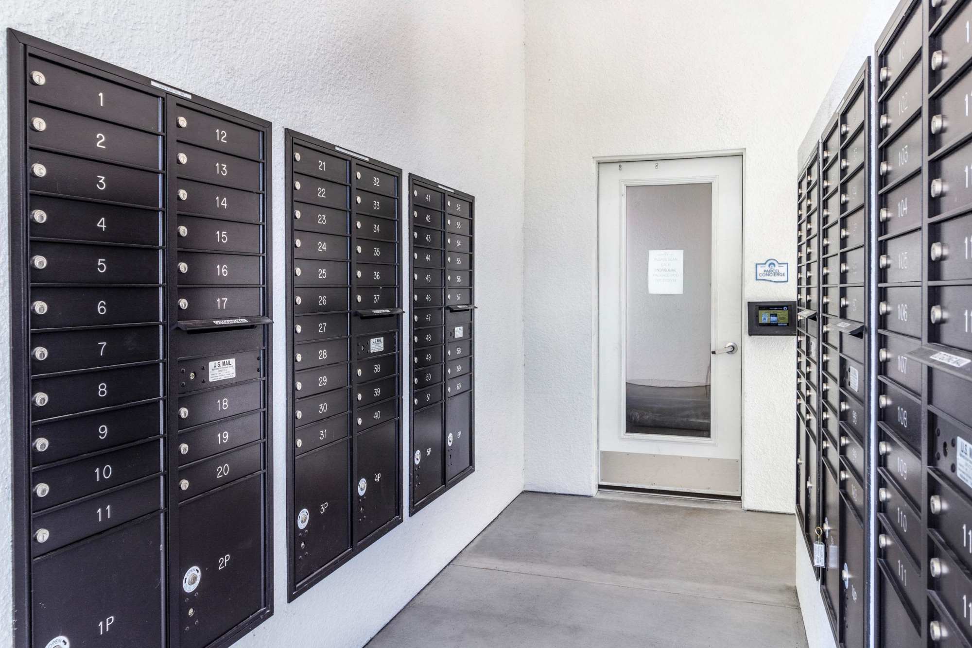 Mailroom with parcel lockers and storage units at Brisa at St. Augustine in St. Augustine, Florida