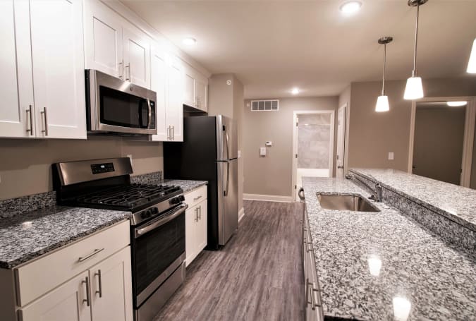 Fully equipped kitchen with stainless steel appliances at Enclave 50 in Ballston Spa, New York