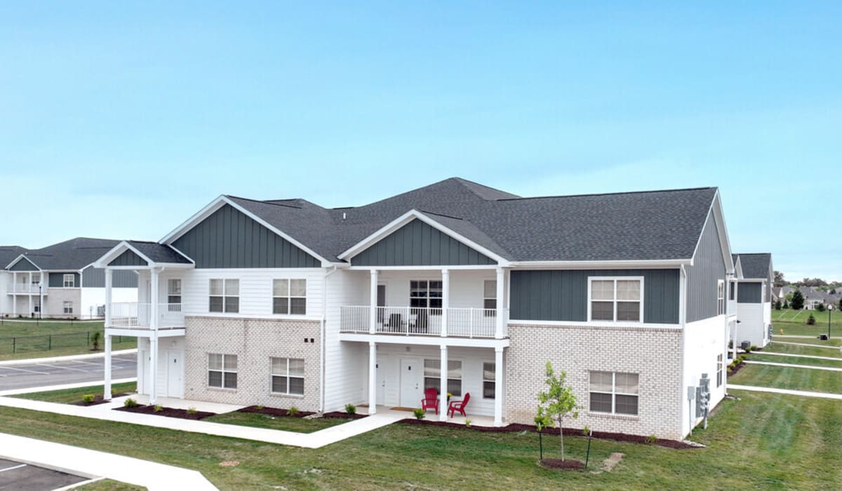 Community apartment exterior view with green lawn at Union Club Apartments in Fort Wayne, Indiana