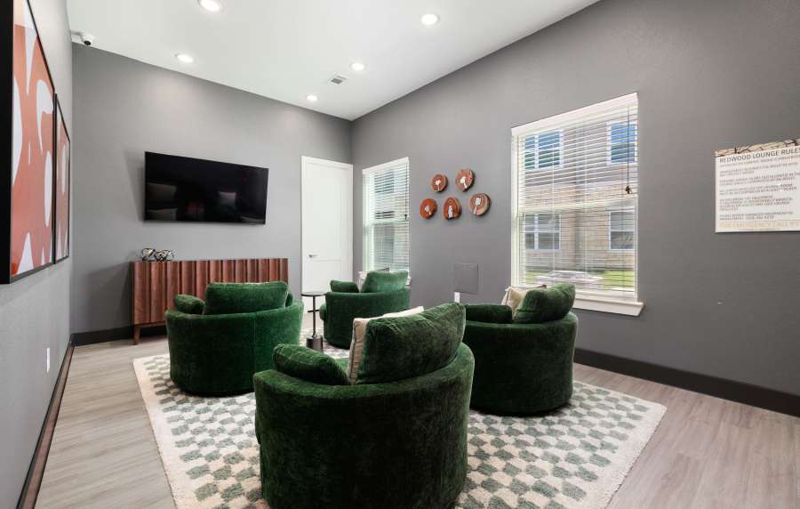 Lounge area with green chairs at Redwood in San Marcos, Texas