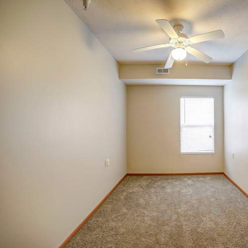 Well-lit apartment bedroom at Brentwood Greene in Kokomo, Indiana