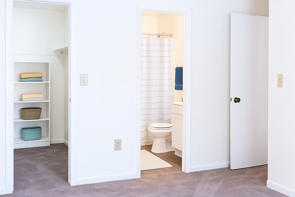 Bedroom with attached bathroom at Creekwood Apartments in Gainesville,Florida
