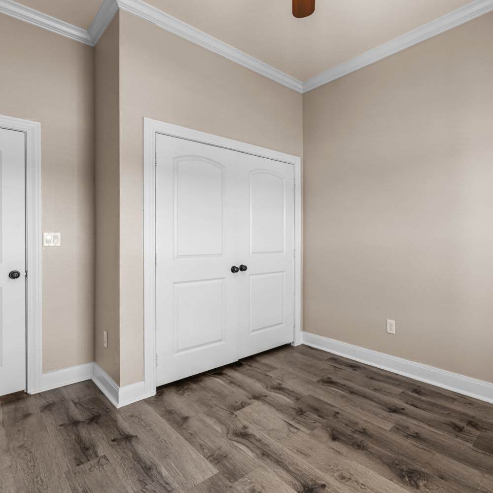 Bedroom with closets at The Arbors of Mineola in Mineola. TX