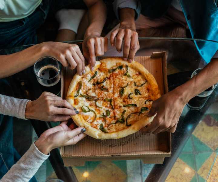 Residents enjoying pizza near Landmark Apartments in Chesapeake, Virginia