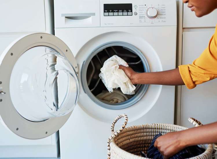 REsident using laundry services at Union Crossing in Lawrence, Massachusetts