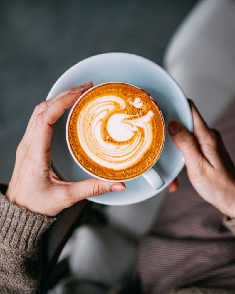 A resident holding a cup of coffee near Integra Heights in Clermont, Florida