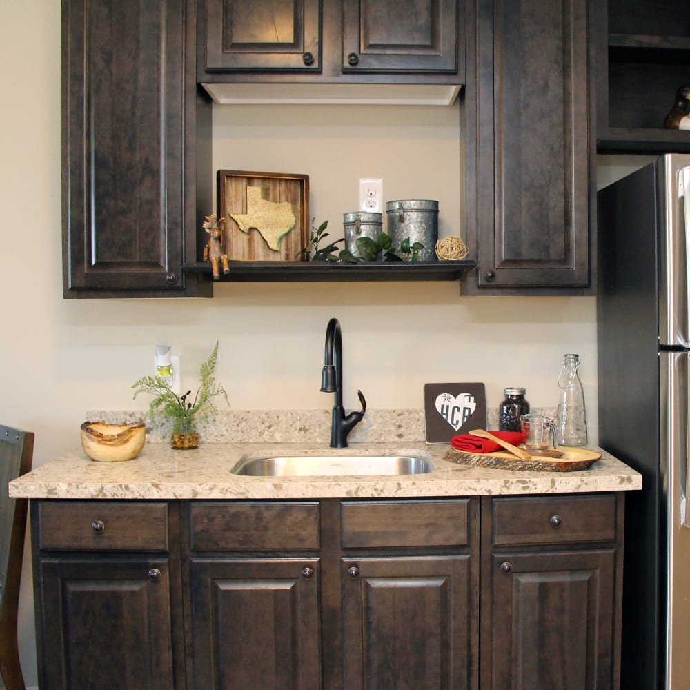 A kitchenette in a assisted living room at Inspired Living in Royal Palm Beach, Florida