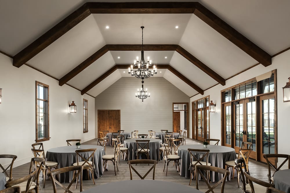Tables and chairs in the clubhouse at BB Living at Union Park in Phoenix, Arizona
