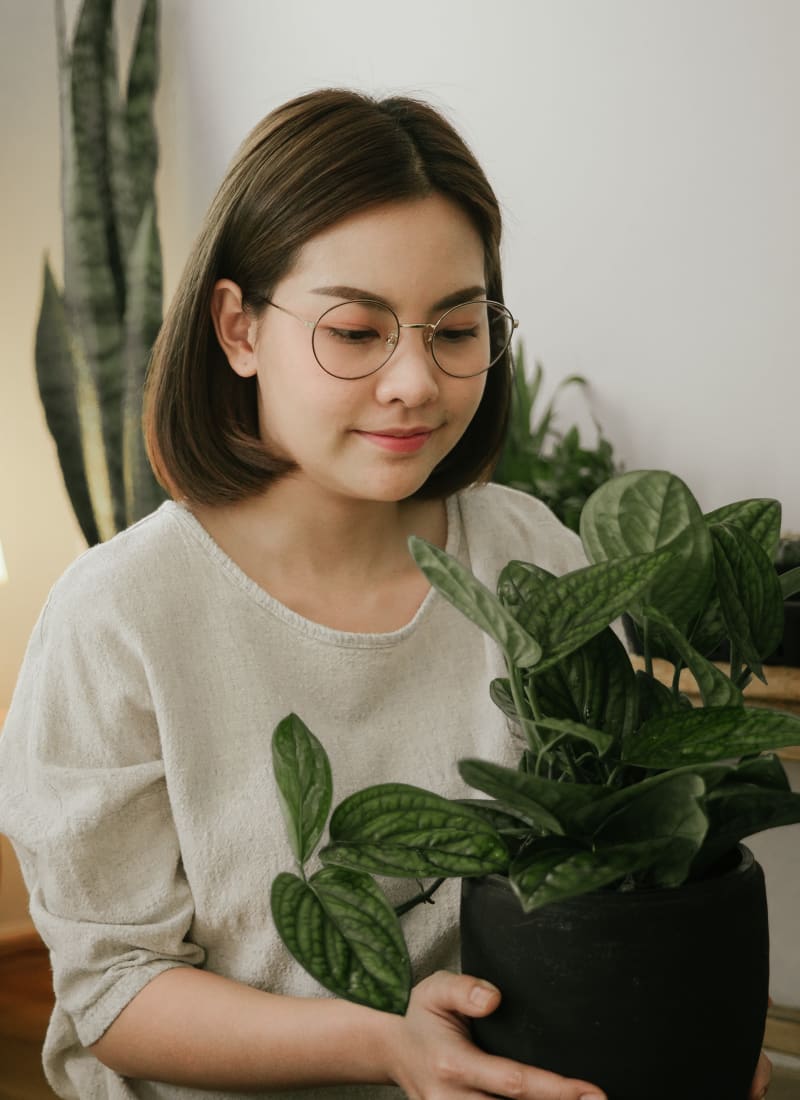 Resident holding their plant at Marquis on Edwards Mill in Raleigh, North Carolina