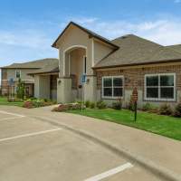 Leasing office exterior view at Pine Creek in Paris, Texas