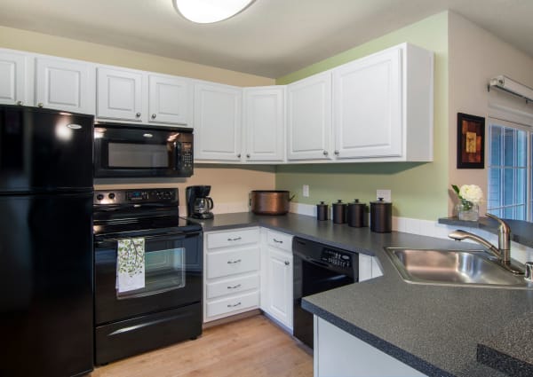 renovated white kitchen model at Autumn Chase Apartments in Vancouver