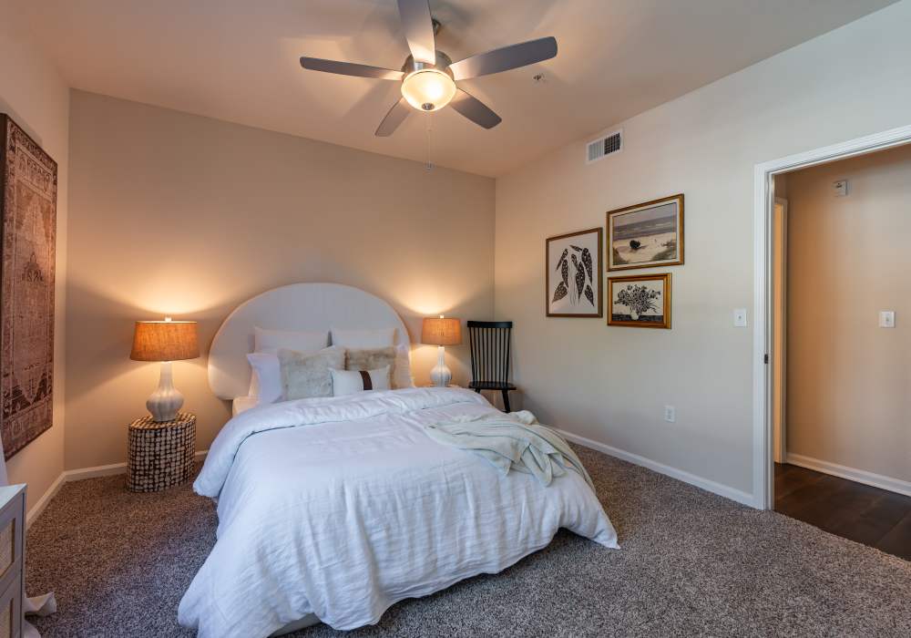 Spacious bedroom with large comfortable bed at Links at Westridge in Valencia, California