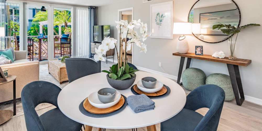 Beautiful kitchen table with fresh flowers at Bermuda Cay in Boynton Beach, Florida