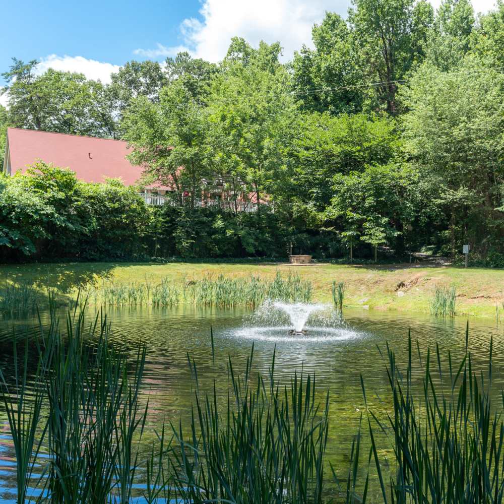 A fountain in the center of the pond at Park Canyon in Dalton, Georgia