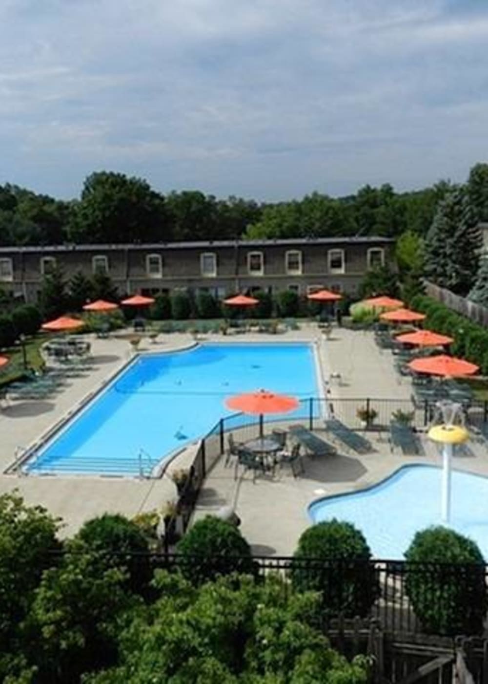Pool deck surrounded by chairs and umbrellas at River Oaks in Pittsburgh, Pennsylvania