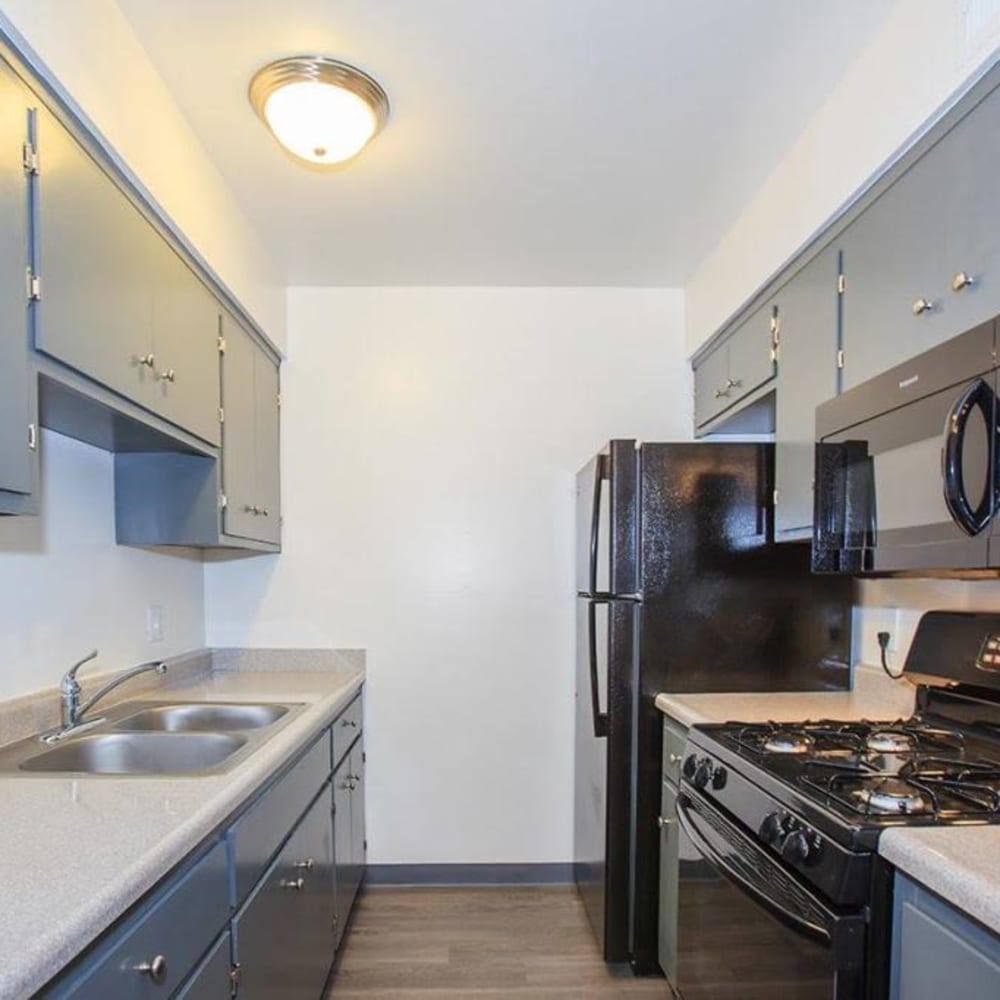 Model kitchen with plank flooring at El Cazador in Fresno, California