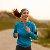 Woman jogging on a path near Sagamore Apartments in Benbrook, Texas