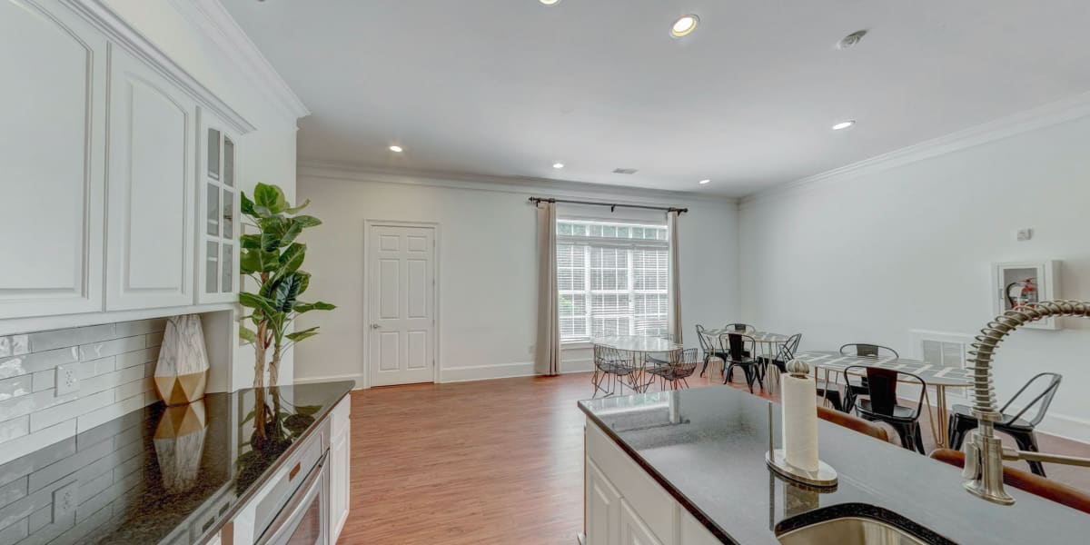 Stylish kitchen equipped with granite countertops and close access to dining space at Madison Park in Madison, Alabama