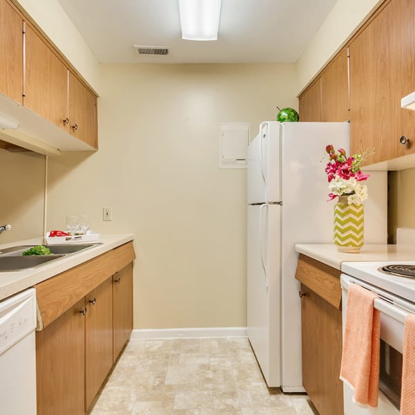 Fully equipped kitchen with white appliances at The Commons at Kettering