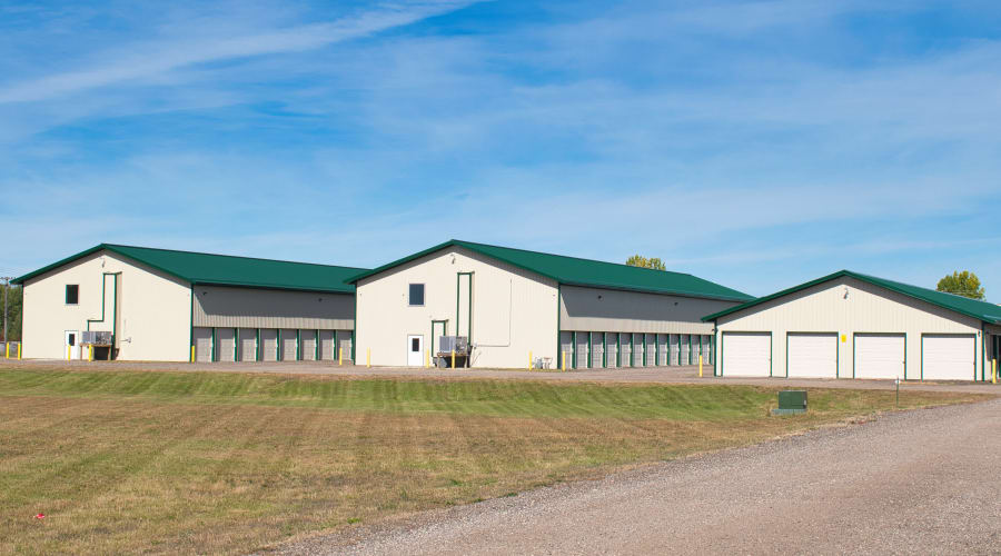 A family carrying storage boxes into their new home near KO Storage in Detroit Lakes, Minnesota