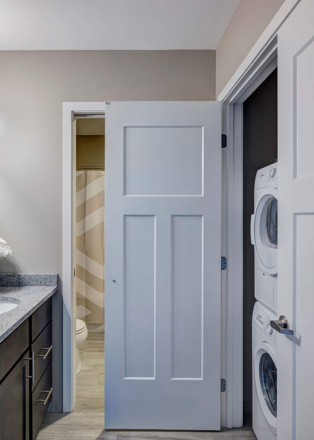Garden style white door with gray walls and granite at Commonwealth Landing Lofts in Fall River, Massachusetts