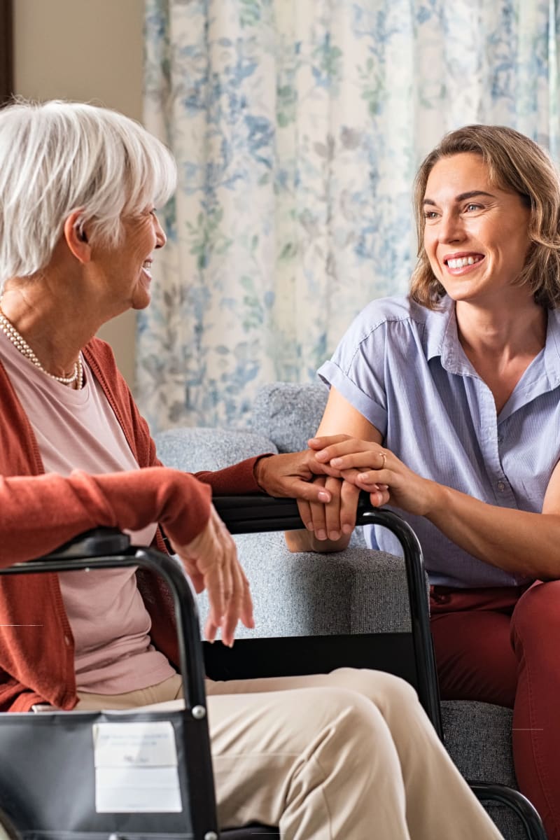 Resident talking with a therapist at Carriage Inn Lake Jackson in Lake Jackson, Texas