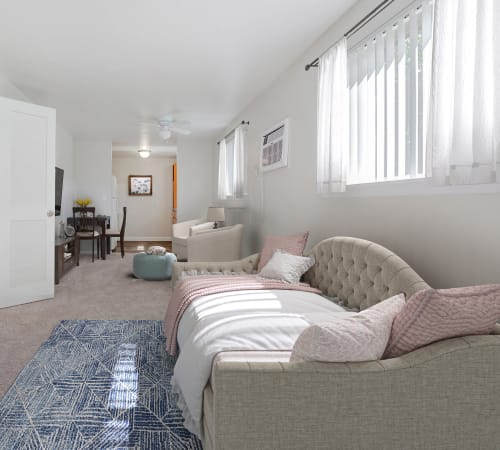 Studio apartment with wall to wall carpeting at Long Pond Gardens Senior Apartments in Rochester, New York