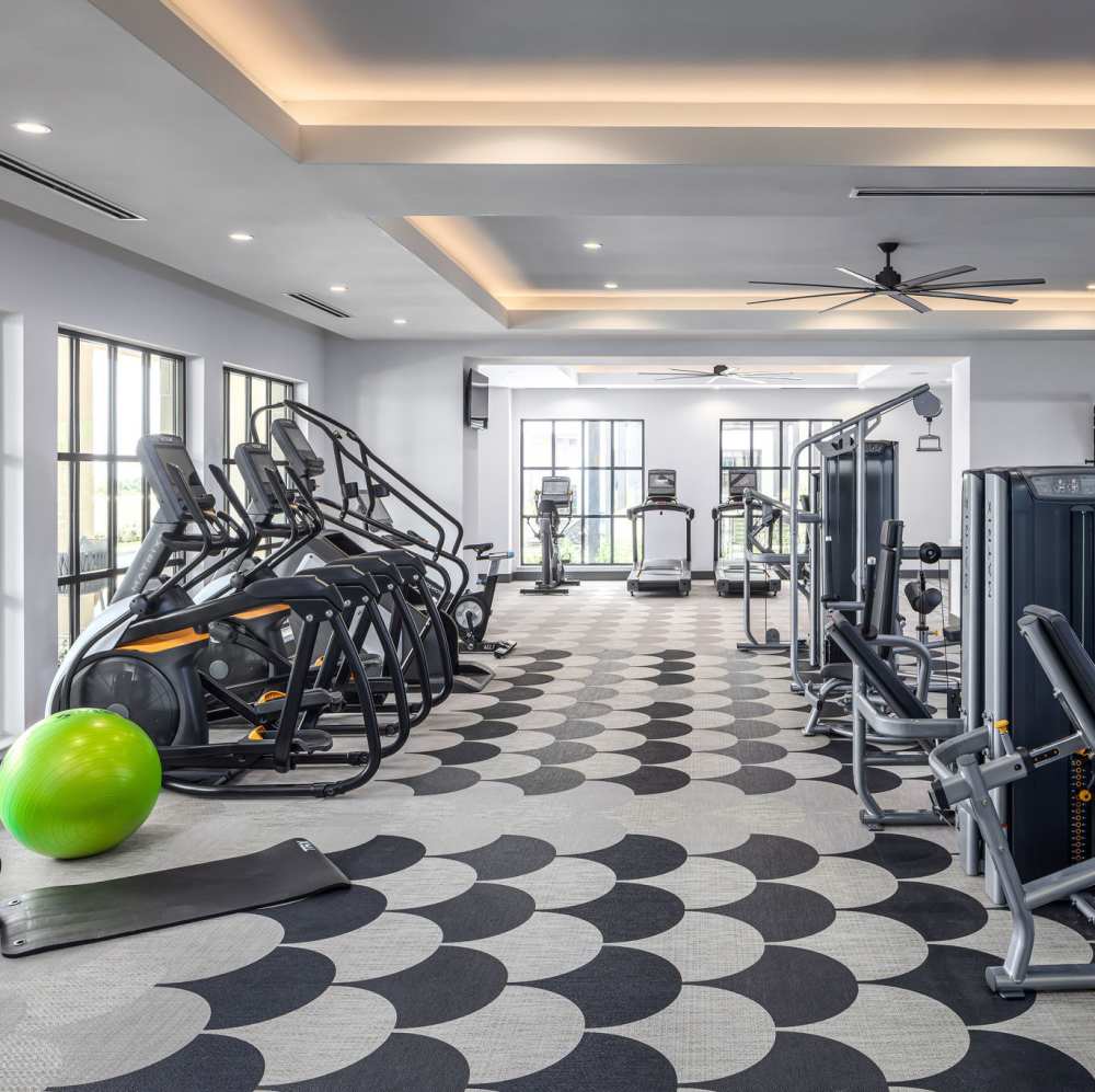 Modern fitness center with cardio machines at Novel Turtle Creek in Dallas, Texas