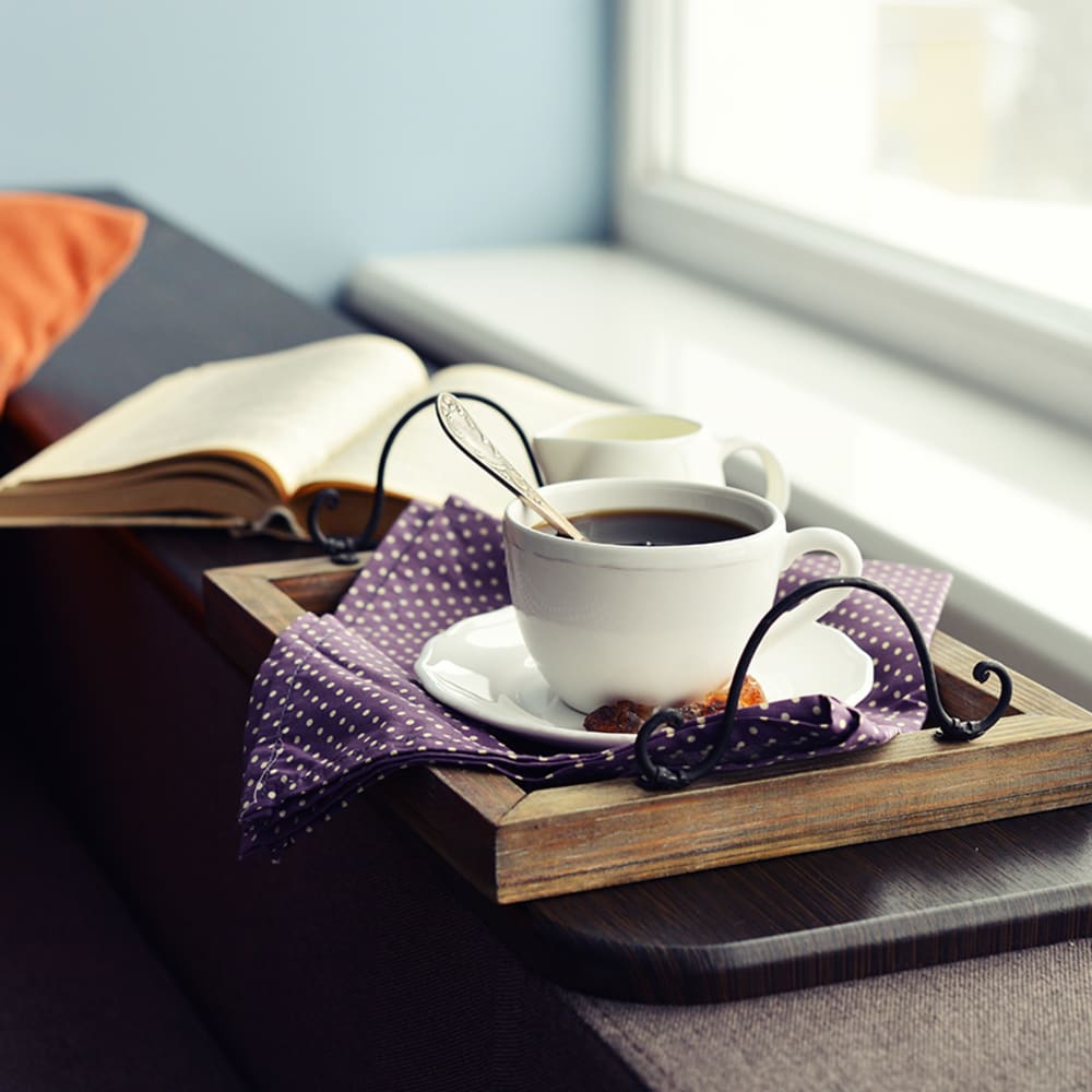 Coffee mug on a tray in a windowsill at Arborgate Apartments Homes in Charlotte, North Carolina