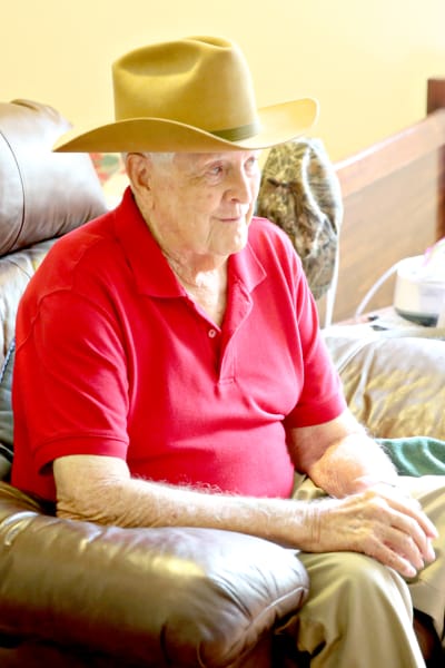 A resident relaxing in a cozy chair at Providence Assisted Living in Grenada, Mississippi. 